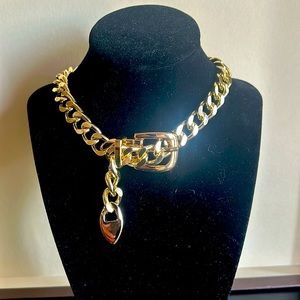 Unbranded, gold tone choker with heart dangle.